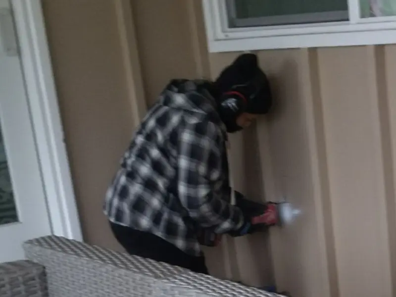 Professional electrician installing an exterior outlet in Mohawk