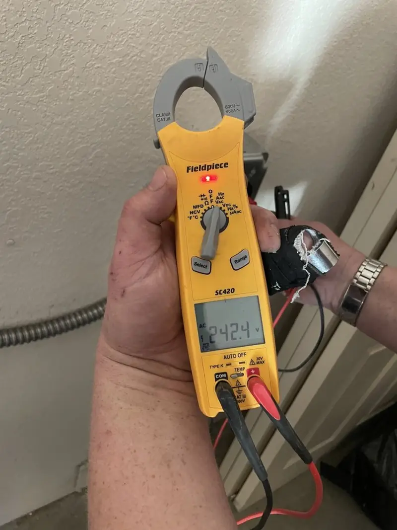 Voltage testing with clamp meter during Whole House Surge Protector in Mohawk